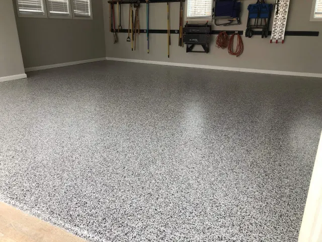 A flake epoxy garage floor by Garage Flooring Pros