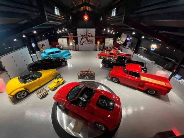 Classic cars on a polished Garage Flooring Pros floor in a private showroom