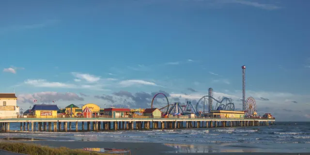 The Galveston pier at dusk, one of Vello's rental markets